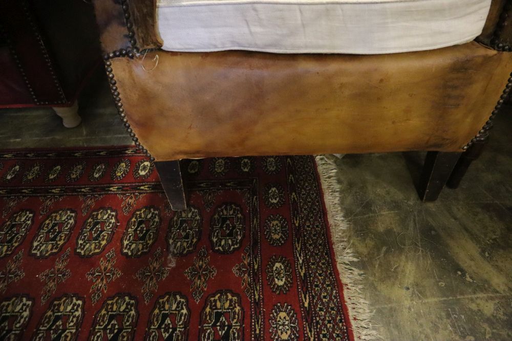 A French tan leather club armchair (a.f), width 76cm, depth 70cm, height 87cm